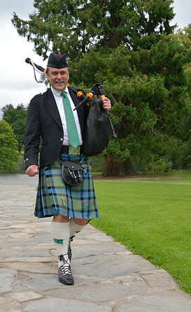 Scotish Bagpiper at Eilane Donan Castle