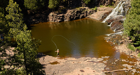 Fly fishing by the falls
