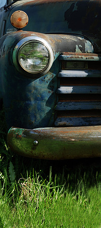 Chevy truck behind the barn