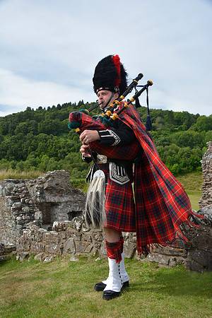 Scotish Bagpiper at Castle Stalker